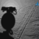 A photo showing Yutu 2's shadow and tracks.